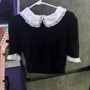 black ribbed sweater with lace sleeves and collar